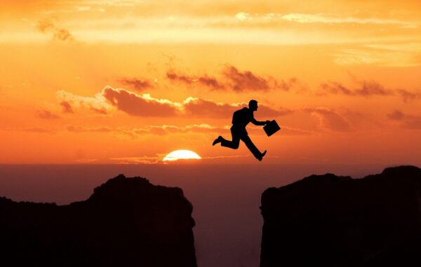 jump cliff sunset businessman 5266634