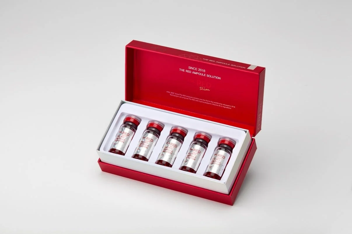Caja de "THE RED AMPOULE SOLUTION Slim" con 5 ampollas rojas.