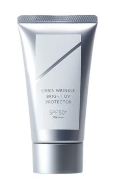 ORBIS Wrinkle Bright UV Protector N en envase plateado
